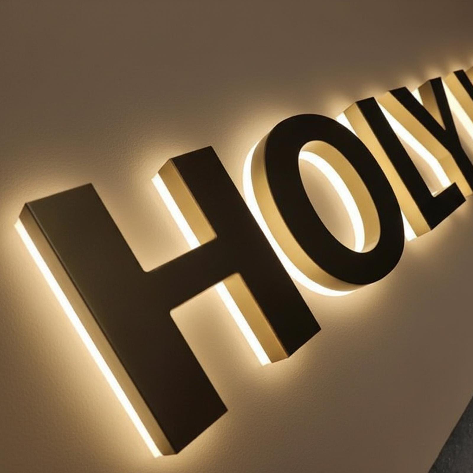 Detail or illuminated view - custom champagne gold halo backlit logo signs