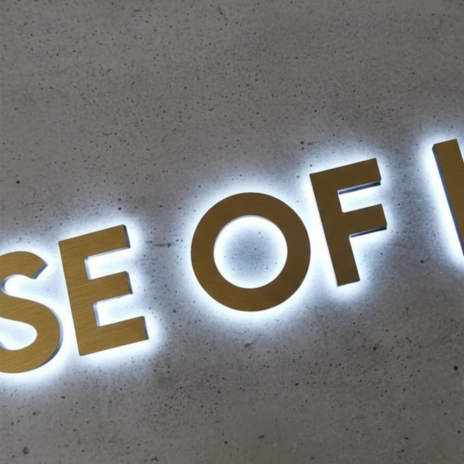 Supporting project view - custom gold stainless steel halo logo letters