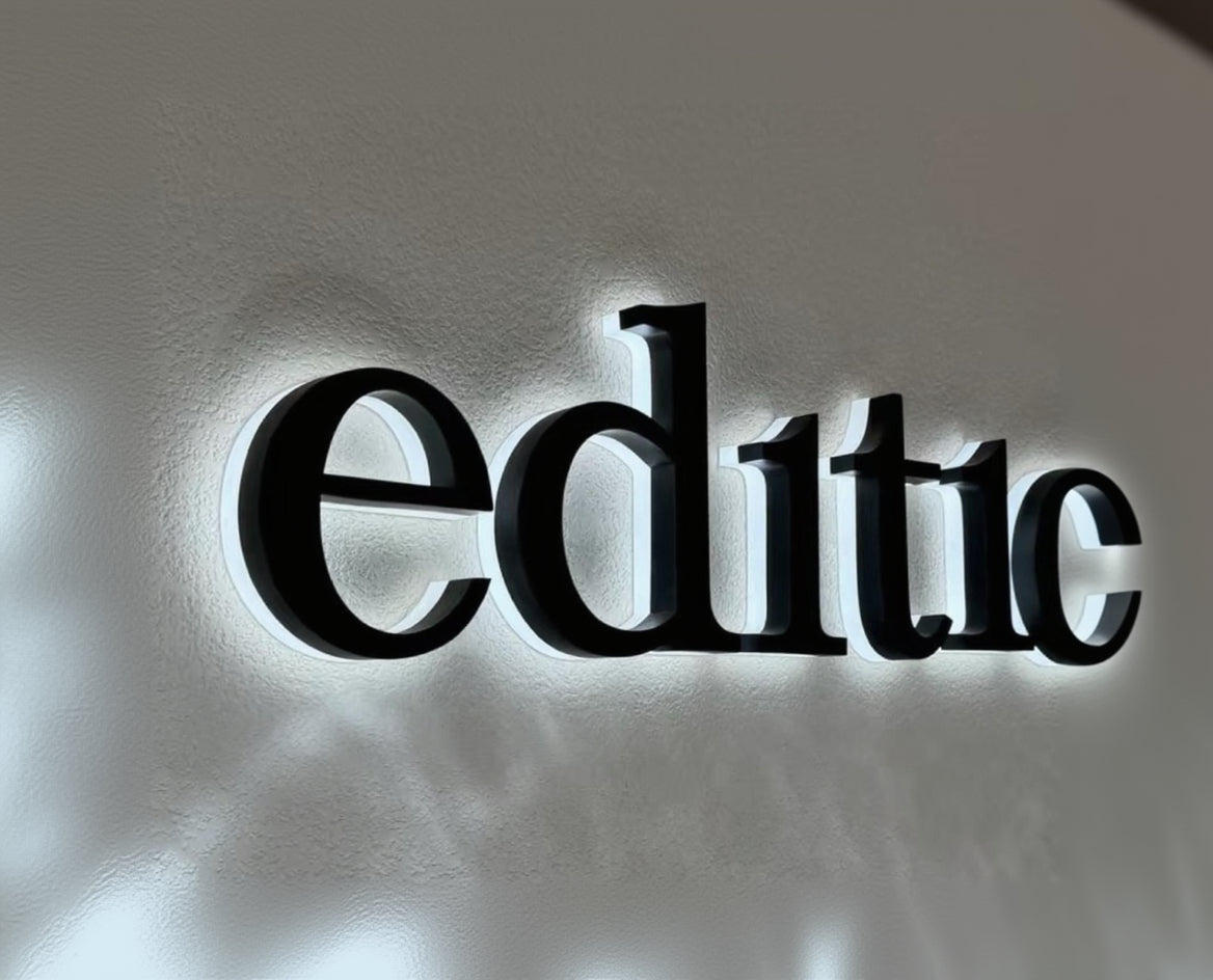 Detail or illuminated view - custom metal halo backlit logo signs for storefronts and reception walls