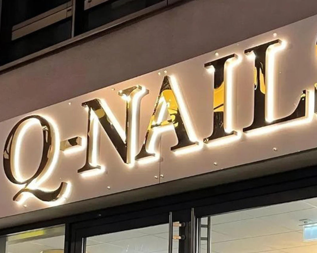 Installed main scene - custom metal halo backlit logo signs for storefronts and reception walls