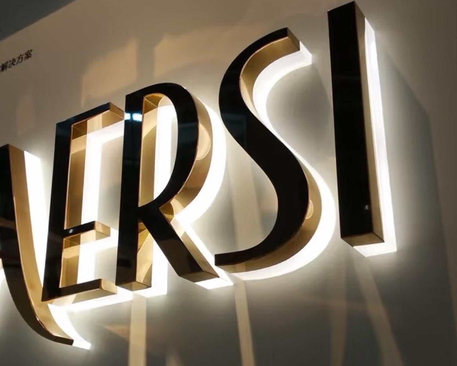 Supporting project proof - custom metal halo backlit logo signs for storefronts and reception walls